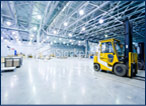 brightly lit warehouse with forklift